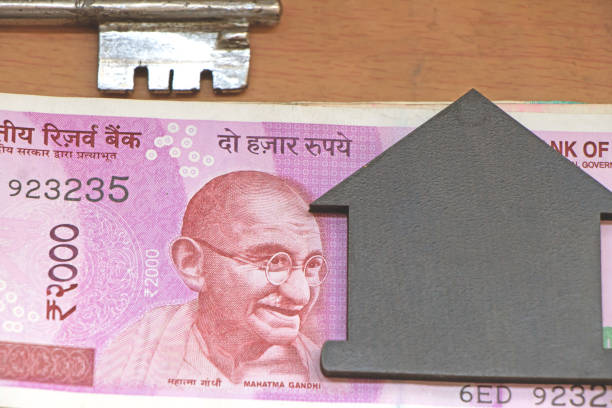 istock House model view with paper currency and key in the background 1180242923