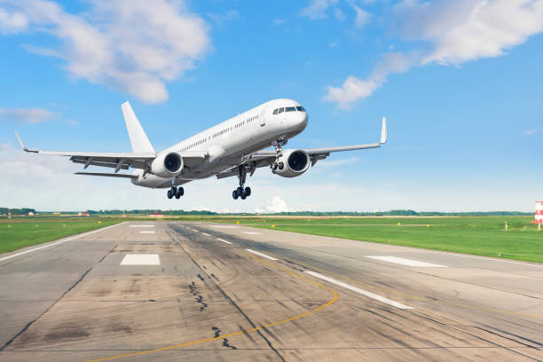 istock Passenger plane lands on runway at airport. 1180243563