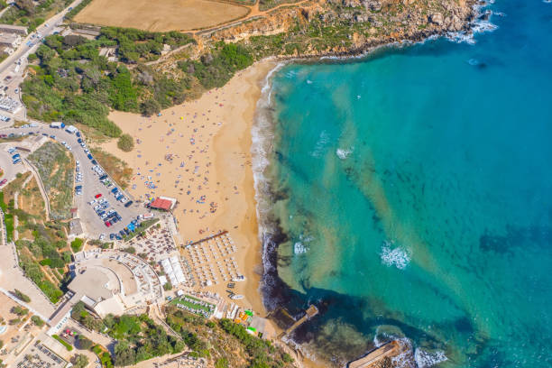 Aerial vew from fying drone view of the wild beach with sunbathers resting people. Aerial vew from fying drone view of the wild beach with sunbathers resting people lagos nigeria stock pictures, royalty-free photos & images