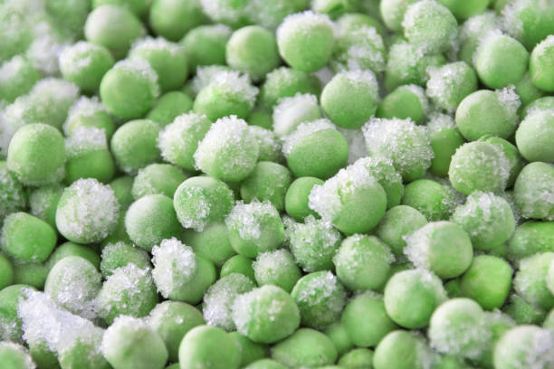 Frozen peas close-up background stock photo