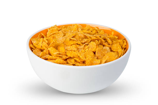 istock white orange bowl with fresh crunchy cornflakes isolated breakfast background 1180245815
