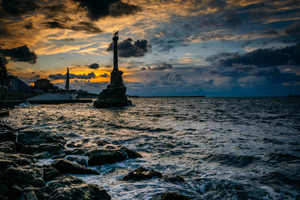 Monument to the Sunken Ships Monument to the Sunken Ships against the backdrop of the beautiful sunset. scuttle stock pictures, royalty-free photos & images