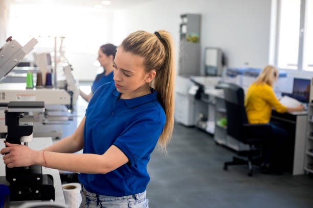 istock Female workers in printing factory 1180248123