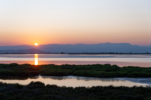 warm colors at sunset on ebro delta national parkin catalunya, a scenic landcape of serenity and silence