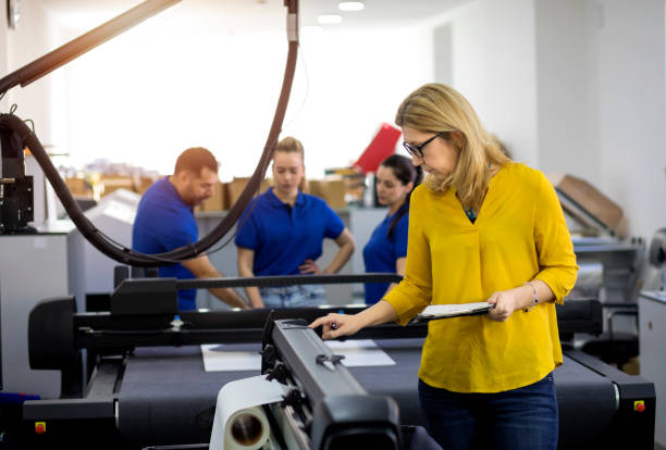 istock Coworkers in printing factory 1180248264