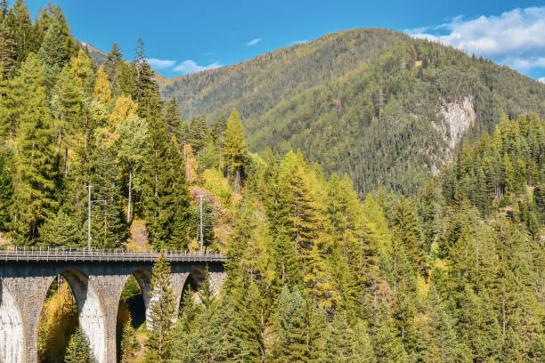 istock Swiss autumn landscape with the Wiesener viaduct. 1180248340
