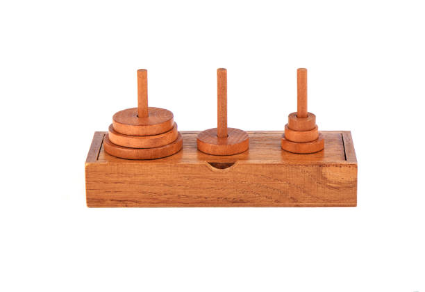 istock Wooden puzzle tower of hanoi over white background. 1180249817