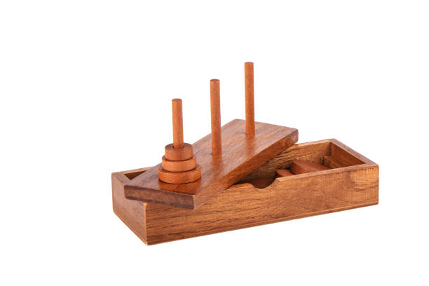 istock Wooden puzzle tower of hanoi over white background. 1180249831