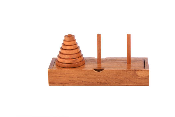 istock Wooden puzzle tower of hanoi over white background. 1180249851