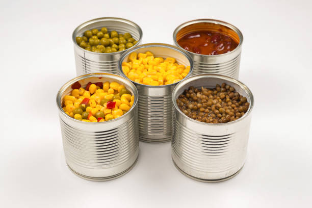 istock Canned food on white background. Green pea, beans, corn, lentils. 1180250328