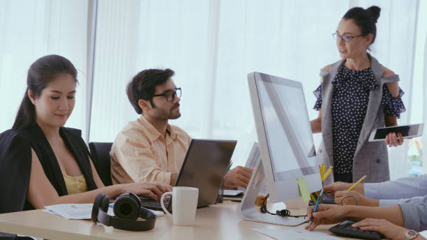 istock Senior leader giving advice speech to team members 1180251859