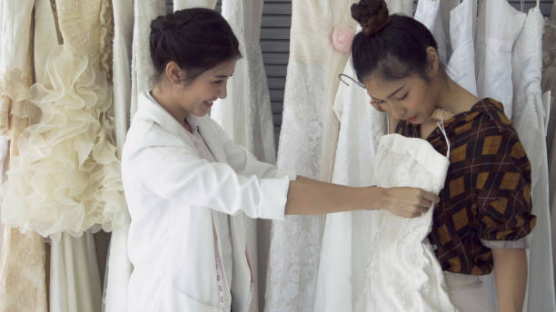 istock Future bride customer talking with wedding store shopkeeper 1180251940