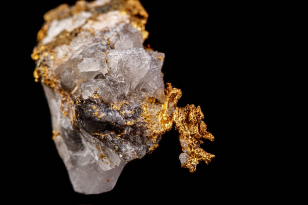 istock macro mineral stone gold in the rock on a black background 1180252222