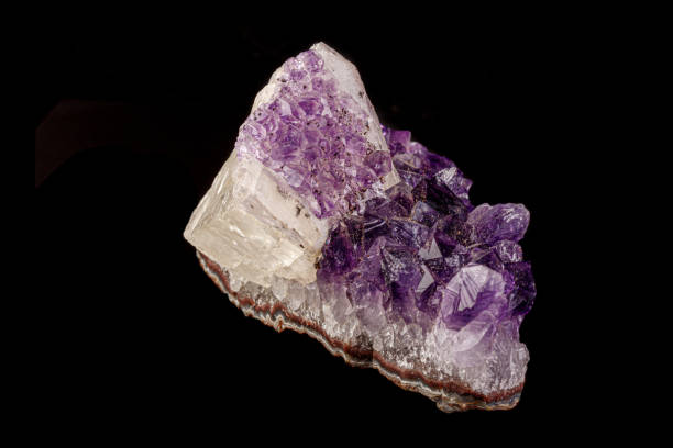 istock macro mineral amethyst stone with calcite black background 1180252345