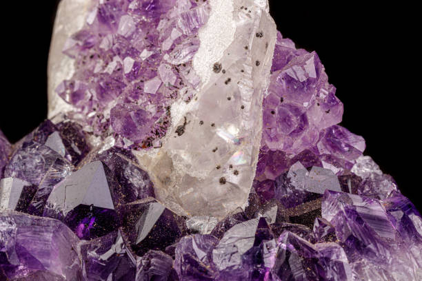 istock macro mineral amethyst stone with calcite black background 1180252904