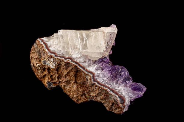 istock macro mineral amethyst stone with calcite black background 1180253531