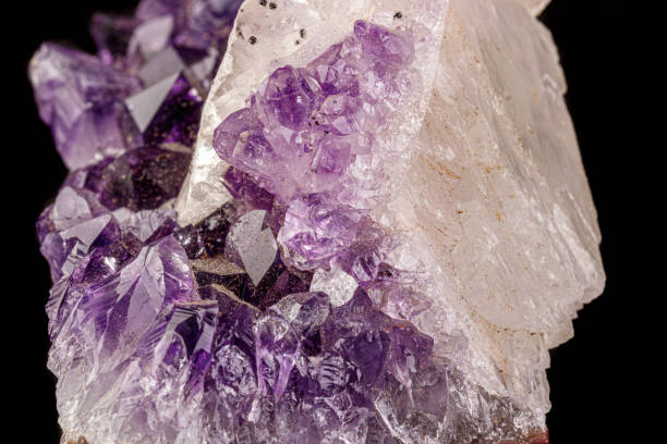 istock macro mineral amethyst stone with calcite black background 1180254148
