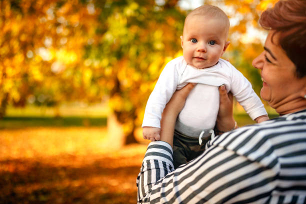 istock Mother with baby in park 1180254545