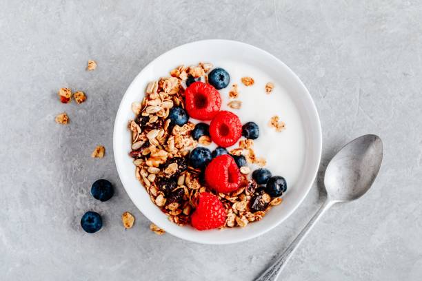 istock Healthy breakfast bowl homemade granola with fresh blueberry and raspberry 1180254622