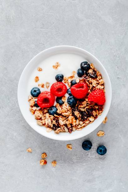 istock Healthy breakfast bowl homemade granola with fresh blueberry and raspberry 1180254718