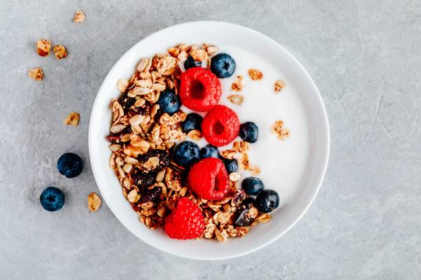istock Healthy breakfast bowl homemade granola with fresh blueberry and raspberry 1180254787