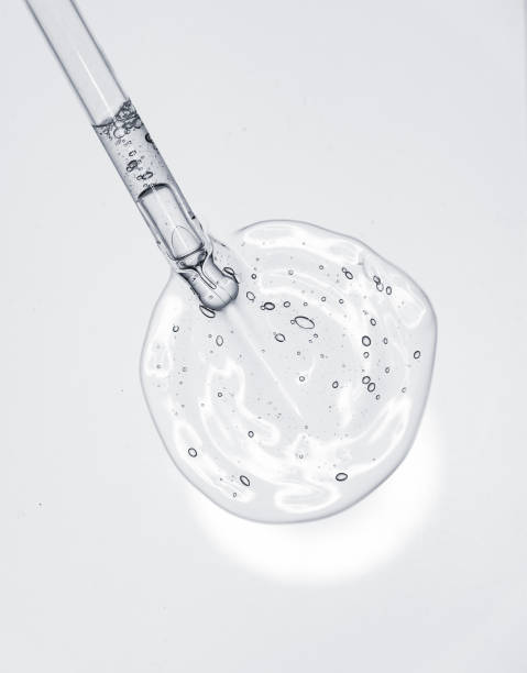 istock Liquid serum gel on a table screen of microscope isolated background 1180255848