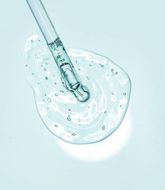 istock Liquid serum gel on a table screen of microscope isolated background 1180256104