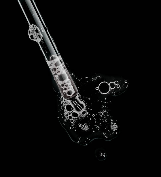 istock Liquid serum gel on a table screen of microscope isolated background 1180256145