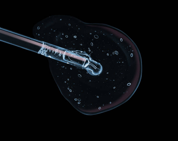 istock Liquid serum gel on a table screen of microscope isolated background 1180256154