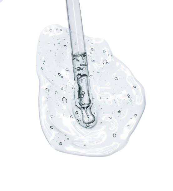 istock Liquid serum gel on a table screen of microscope isolated background 1180256460