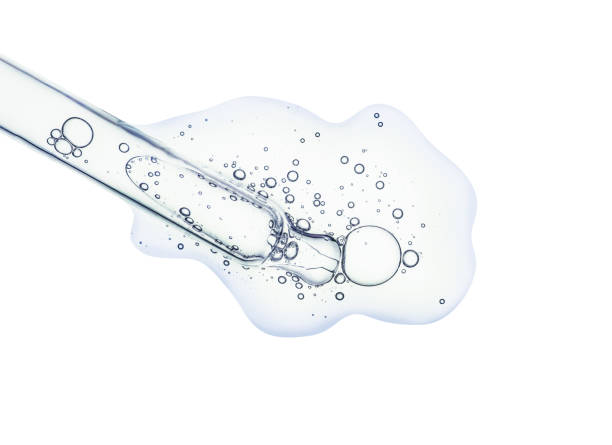 istock Liquid serum gel on a table screen of microscope isolated background 1180256510