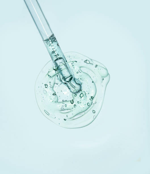 istock Liquid serum gel on a table screen of microscope isolated background 1180257075