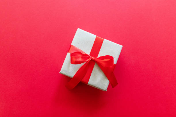 istock Happy Mother day greeting card with decorated gift box on red background. Top view. 1180257155