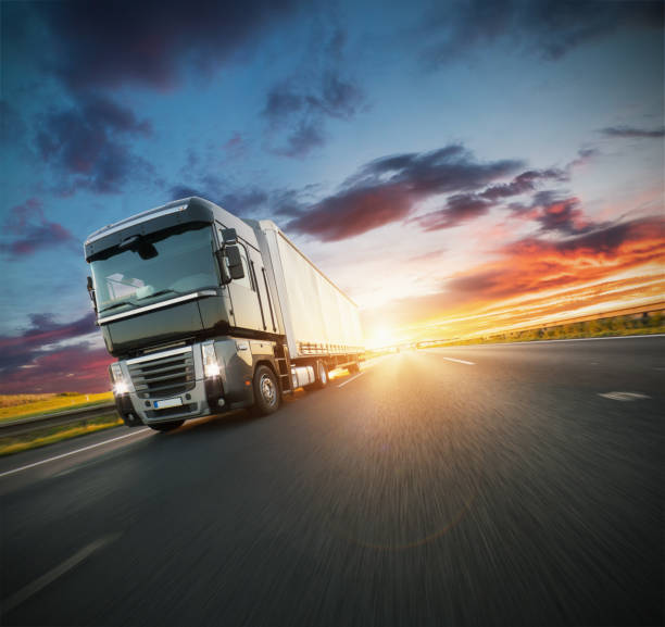 istock European truck vehicle with dramatic sunset light 1180257814