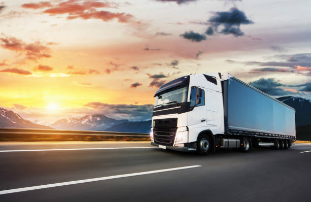 istock European truck vehicle with dramatic sunset light 1180257828