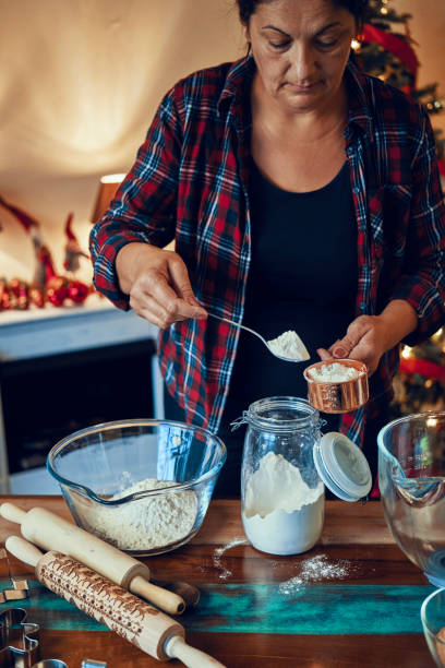 istock Preparing Christmas Cookies in Decorated Home Atmosphere 1180257941