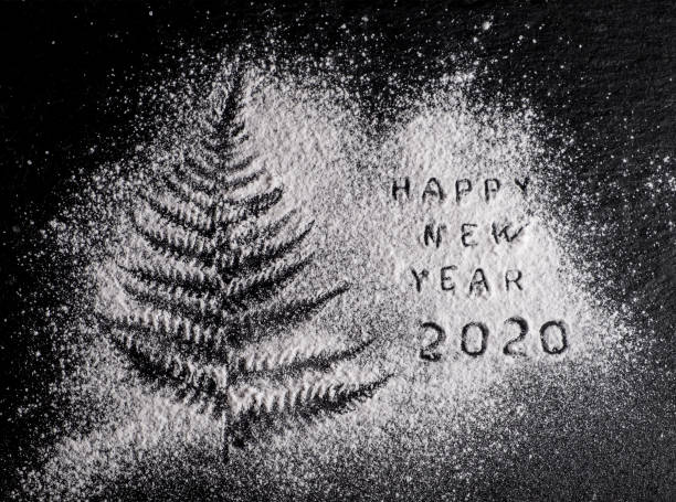 New Year 2020 background. Silhouette of flour on blackbackground stock photo