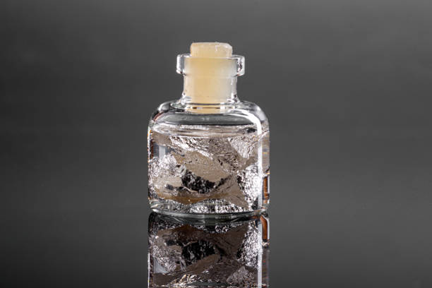 istock macro metal silver in a capsule on a gray background 1180263848
