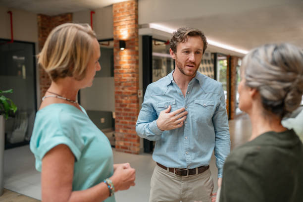 istock Business People Talking In Office Lobby 1180263870