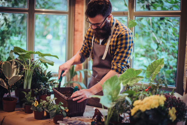 istock Hipster in a greengouse 1180264824