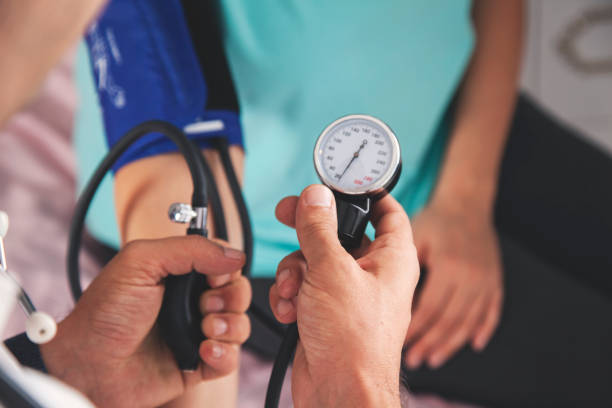 istock pressure device with doctor and ill 1180266081