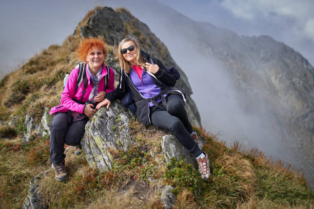 istock Backpacker ladies hiking on a trail 1180266596