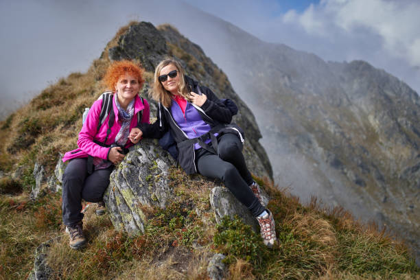 istock Backpacker ladies hiking on a trail 1180266606