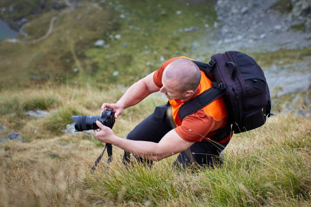 istock Tourist hiking with camera 1180267312