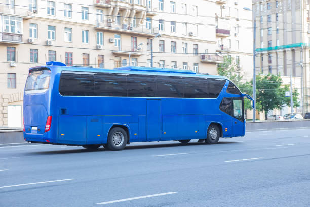 istock tourist bus goes on street 1180268819