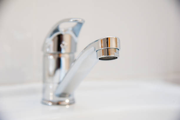 istock Close-up of row modern ceramic wash hand basins 1180269016