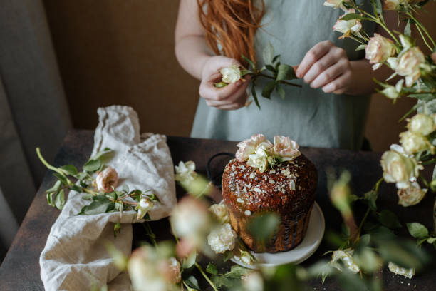 A girl decorates an Easter cupcake
