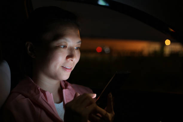 istock Connecting at Night - Smartphone 1180269386