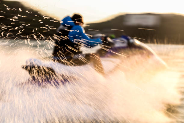 An Action picture of a Jet ski scooter and its rider speeding through the Ocean waters in Kochi city of Kerala in India.