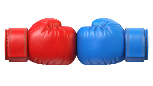 istock Red and blue boxing glove against each other isolated on white background 1180272462